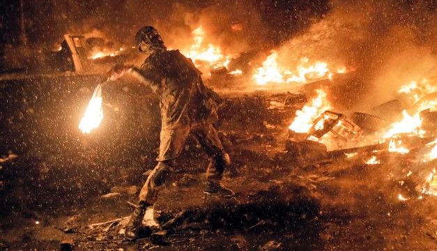 ukraine protester with molotov cocktail