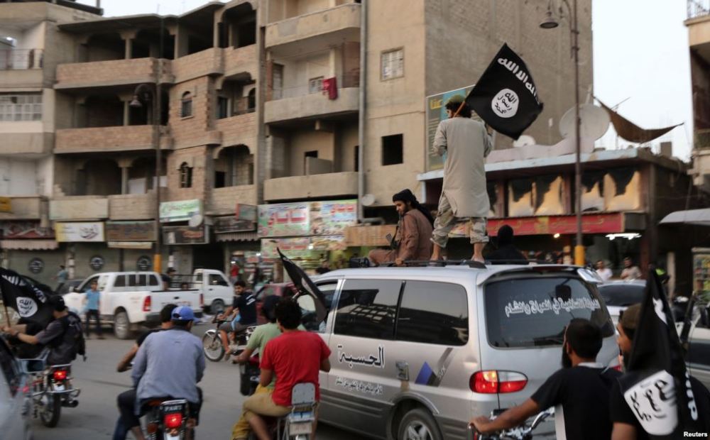 members loyal to isil drive around Raqqa