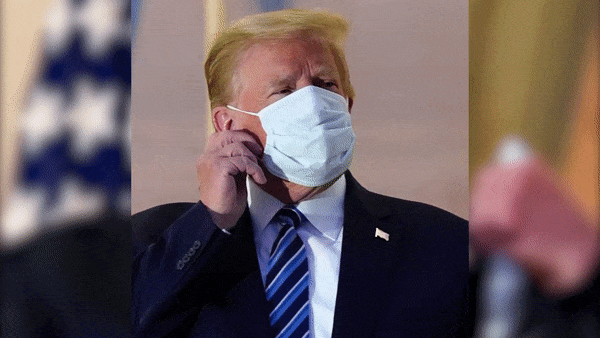 gif of president donald trump removing his mask while diagnosed with coronavirus
